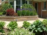 Landscape plantings in beds at rear of house located in Shaker Heights Ohio near Cleveland.